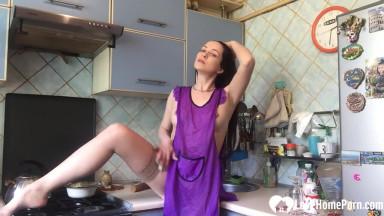 Housewife masturbating in the kitchen