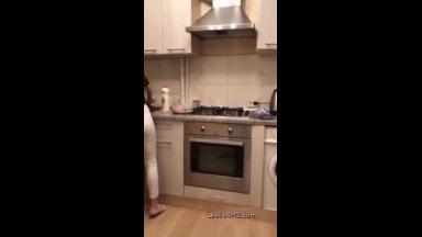 girl blowing on periscope after teasing boyfriend in the kitchen