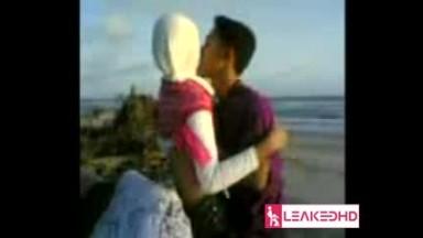 indonesian hijabi girl at the seaside with lover