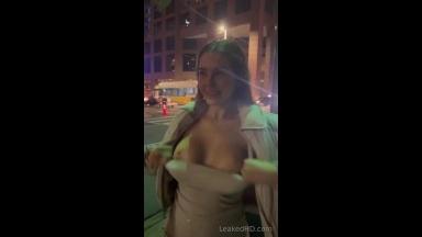 slut showing off her boobs and ass on the streets