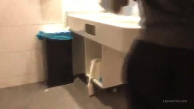 Fit girl sucking dick in public bathroom