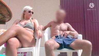 Sexy busty French blonde milf stroking cock by the pool 