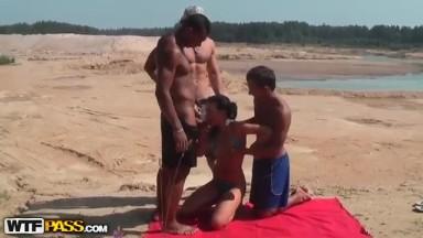 Teen brunette fucked on the beach in all holes