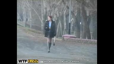 Redhead student sucks on the banks of the river for all to see