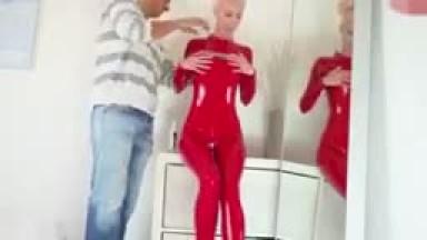 skinny blonde in red latex suit