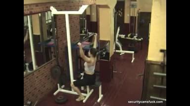 Sexy brunette stripping in the gym